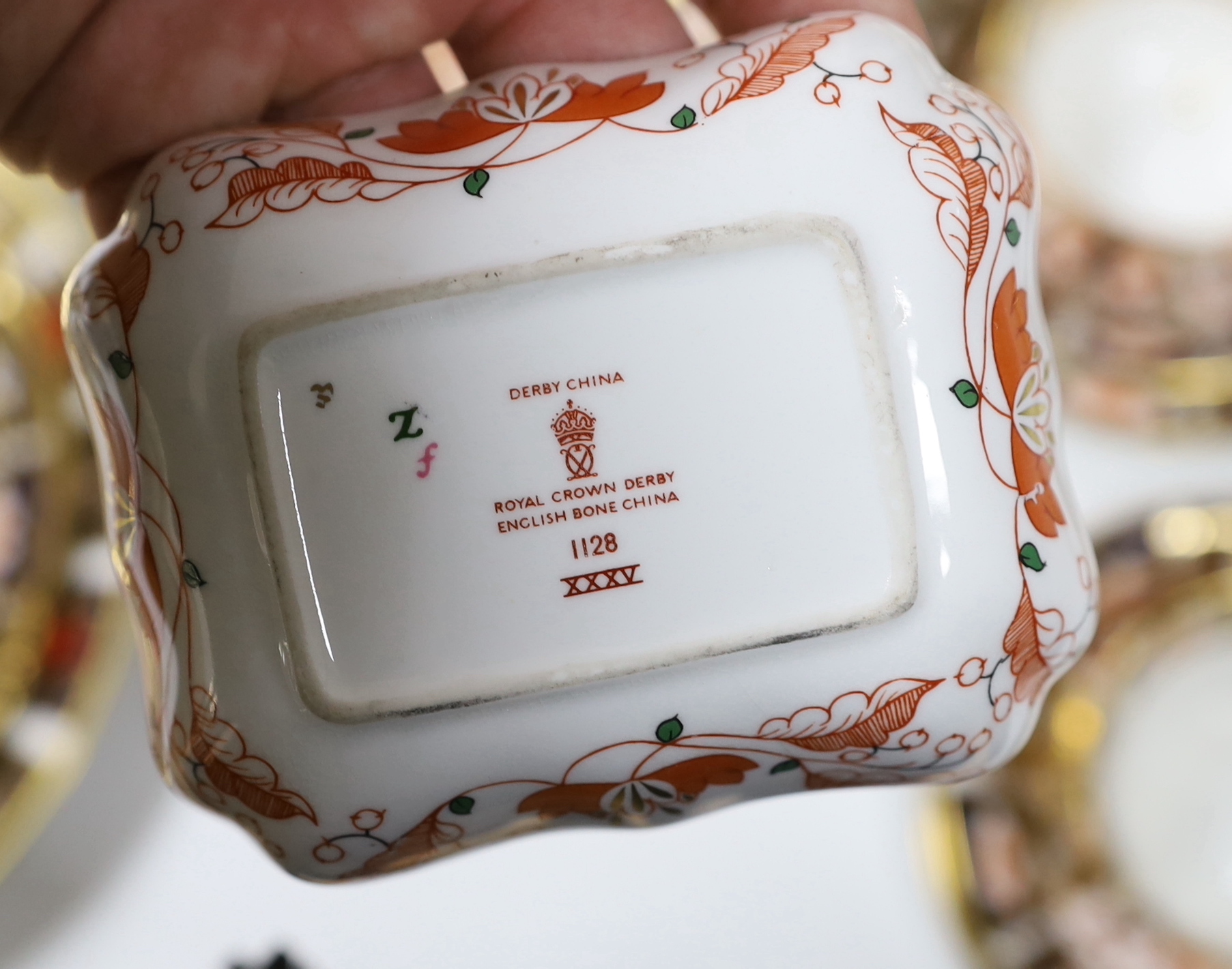 A collection of Royal Crown Derby Imari porcelain, largest 27cm in diameter